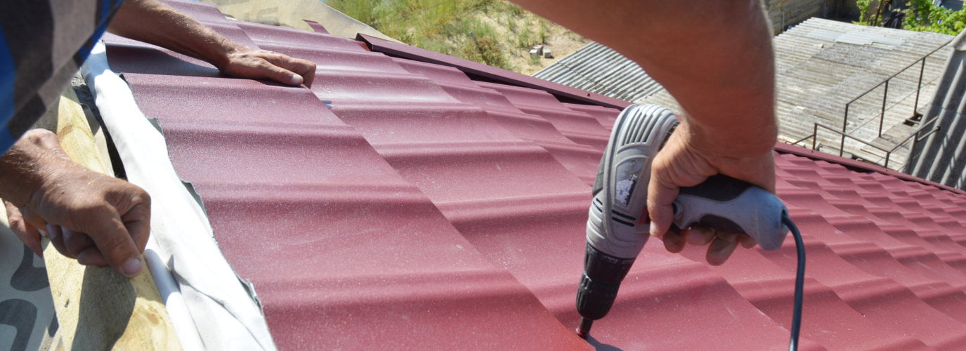 fixing a roof with a drill